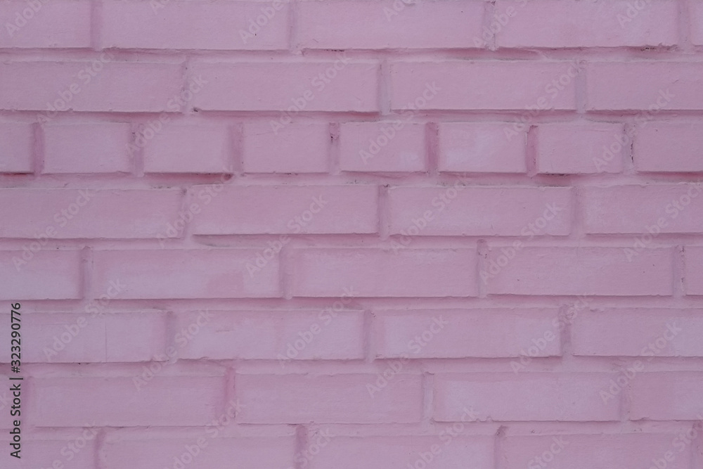 The texture of the brick wall is painted pink. Structure, architecture. The texture of the brick wall is painted pink. Structure, architecture.