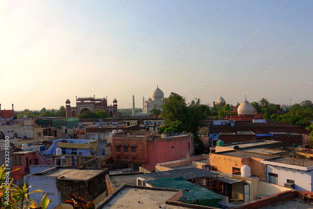 Agra / India - 06.20.2019 : Fabulous Taj Mahal, A UNESCO World heritage inside of the colorful houses of Agra