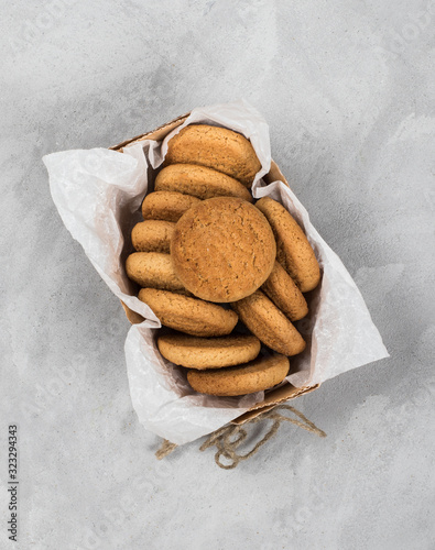 Shortbread oatmeal cookies with milk on a dark gray background