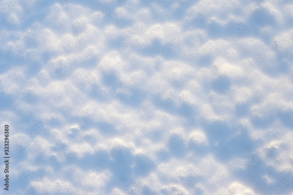 Melted snow with an interesting texture with shadows from bumps Melted snow with an interesting texture with shadows from bumps
