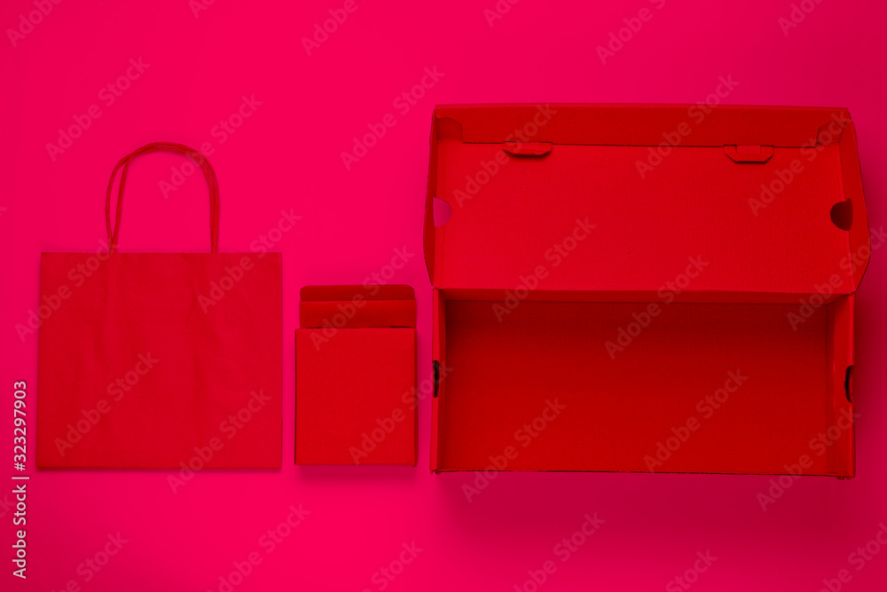 Eco concept. Cardboard boxes, paper bag. Pink neon light Eco concept. Cardboard boxes, paper bag. Pink neon light