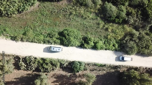 Wallpaper Mural Top down drone video of cars driving a dirt road in Sardinia, Italy.  Torontodigital.ca