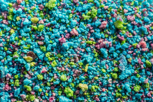 Macrophotography of multi-colored sweet meringue crumbs. Sugar slices, bright sweets