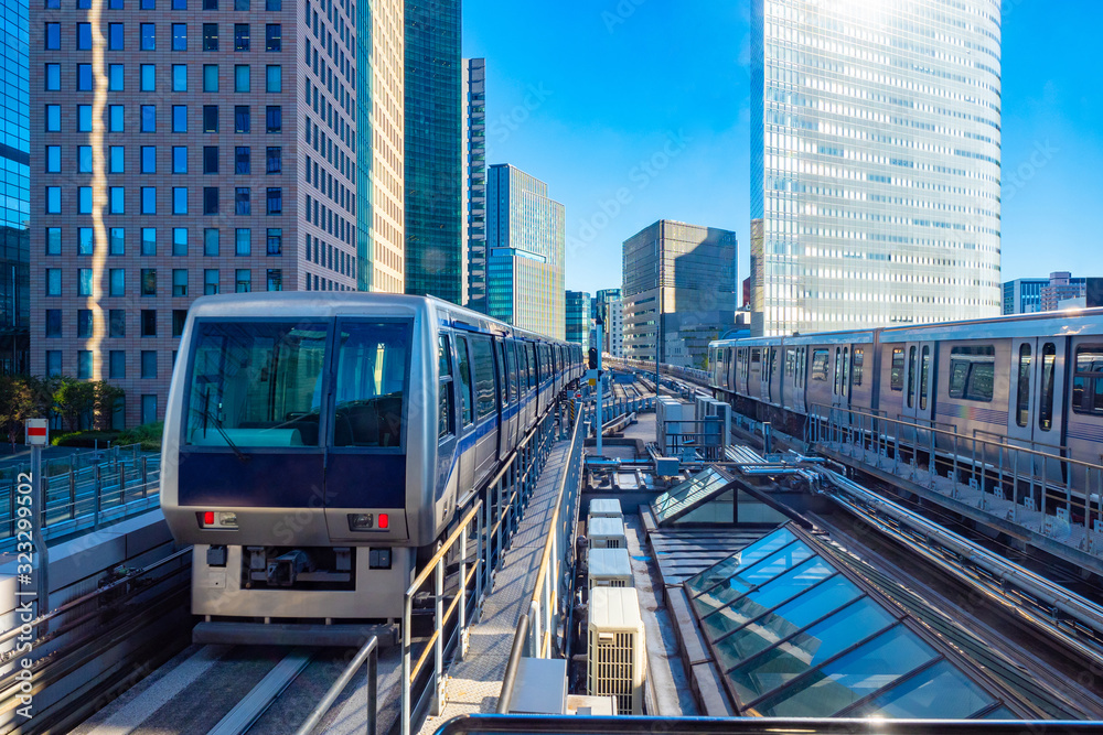 Tokyo. Japan. Unmanned train. Automated guideway transit. Train without a driver traveling by rail. Railways in Japan. Tourism in Tokyo. Traveling in Japan by train. Modern Tokyo. Railroad bridge