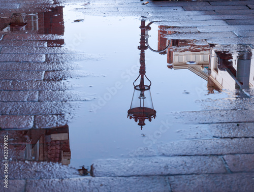 Photography Amsterdam Streetlamp in water reflection wet spot