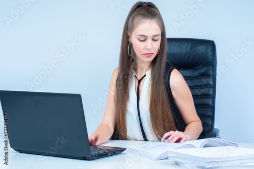 The girl works with documen...