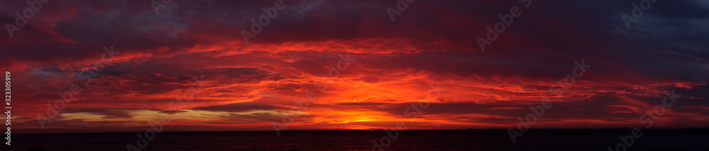 Amazing sky at Sunset red clouds skyline, panoramic photo