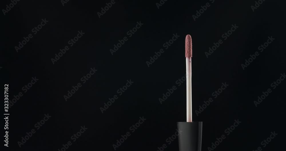 Rotation, lip gloss brushes on a black background. Rotation, lip gloss brushes on a black background.
