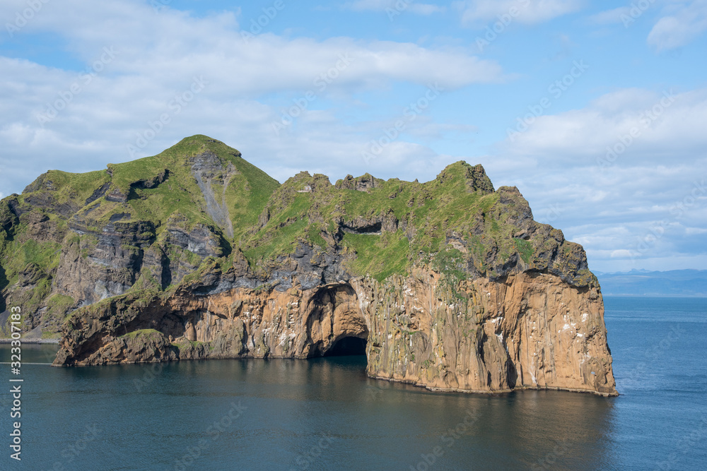 Hole in the cliff on island of Heimaey in Vestmannaeyjar in Iceland