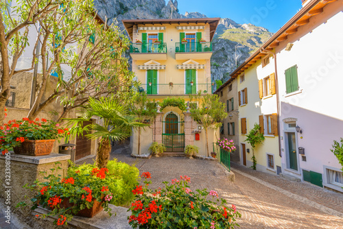 Fototapeta Naklejka Na Ścianę i Meble -  Picturesque small town street view in Limone, Lake Garda Italy.