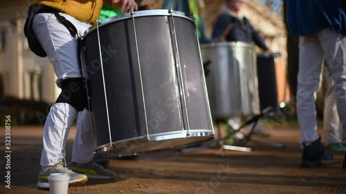 Playing drums. The drummer plays with sticks. Drumline marching band drum corps drummers closeup loop. Musician playing kettledrum