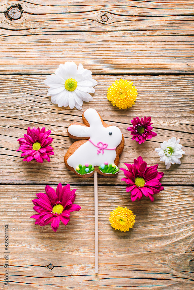 Easter cookies on wooden background, gingerbread in the shape of a rabbit Easter cookies on wooden background, gingerbread in the shape of a rabbit