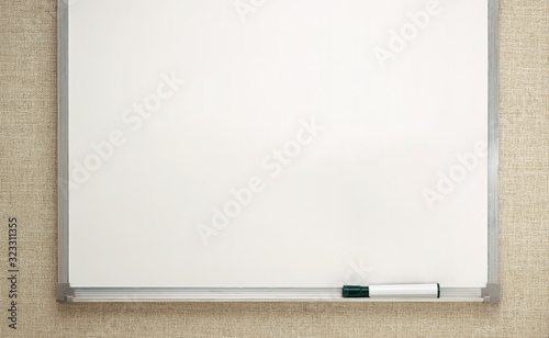empty white board on wall with black marker on tray