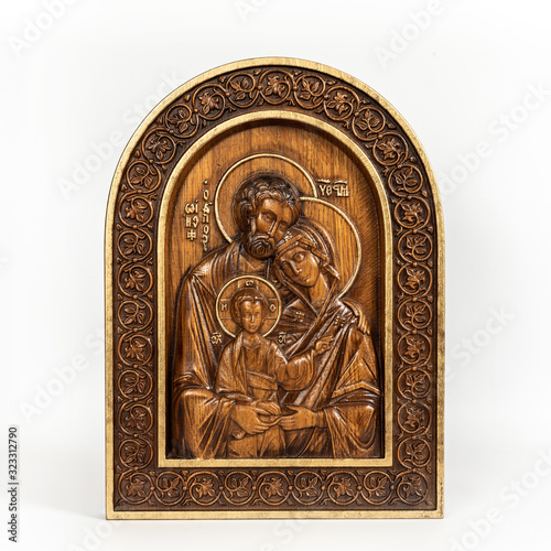 Wooden icon Holy Family on an isolated background.