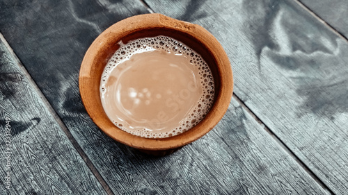 A kulhar or kulhad cup (traditional handle-less clay cup) from North India filled with hot Indian tea