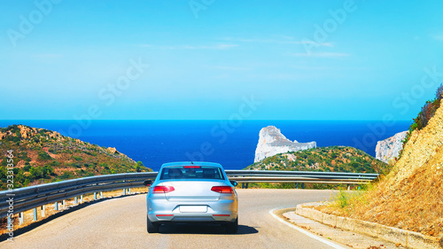 Car on road at Porto Corallo Nebida Mediterranean Sea Sardinia