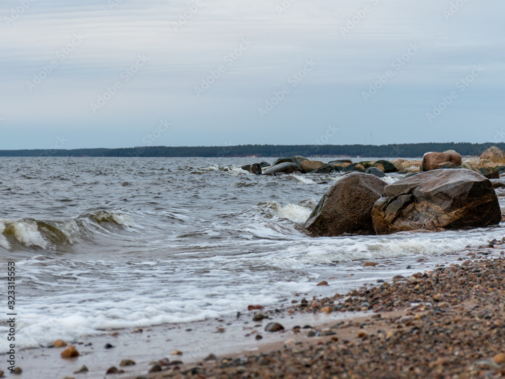 landscape with a rocky beach in the evening landscape with a rocky beach in the evening