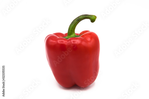 Bright red organic pepper isolated on white background.
