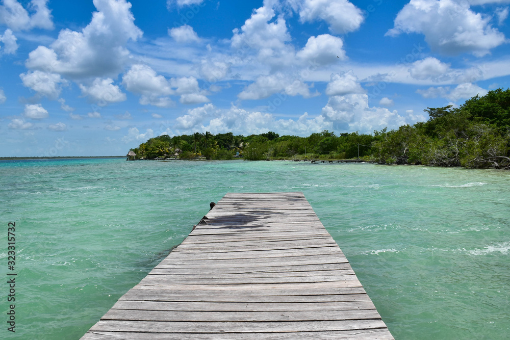 a wood way platform in a turquoise water and nature paradise background a wood way platform in a turquoise water and nature paradise background