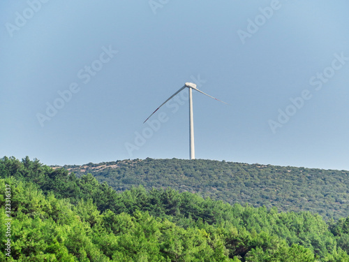 Broken wind turbine  in a wind farm