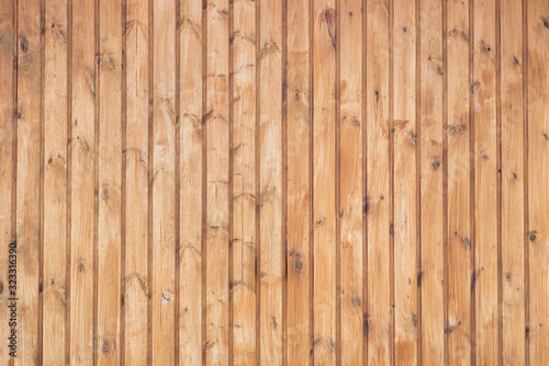 The wall are decorated with natural pine clapboard.