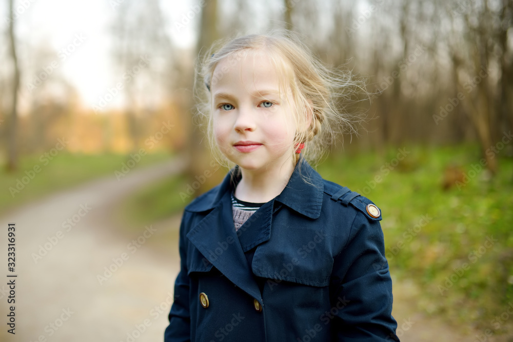 Cute young girl having fun on beautiful spring day. Active family leisure with kids. Cute young girl having fun on beautiful spring day. Active family leisure with kids.