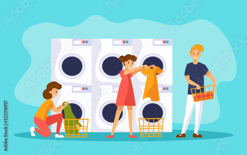 People in laundry shop room with row of industrial washing machines for washing clothes. 