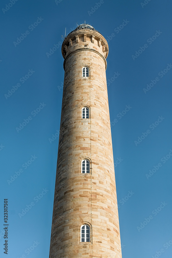 Lighthouse. Close up of an old lighthouse made of stone blocks