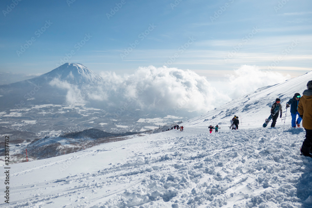 Skiers hiking Niseko Mt. Yotei view