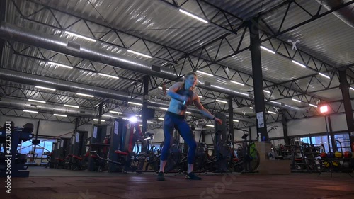 Wallpaper Mural Sports woman is engaged in the gym. The girl shows a good press on her stomach. Beautiful model is engaged in fitness in a sports club. Torontodigital.ca