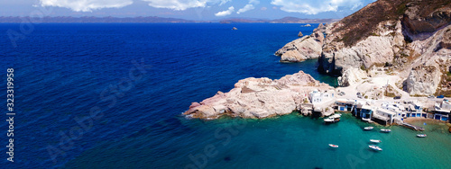 Aerial drone ultra wide photo of famous fishing seaside village of Firopotamos with traditional Cycladic character, Milos island, Cyclades, Greece
