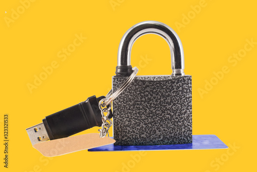 Flash drive and closed lock. Encryption and data security.