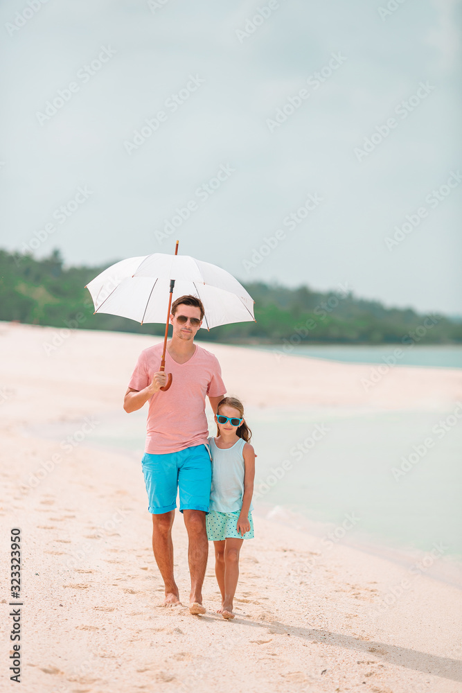 Beautiful father and daughter on the beach Beautiful father and daughter on the beach