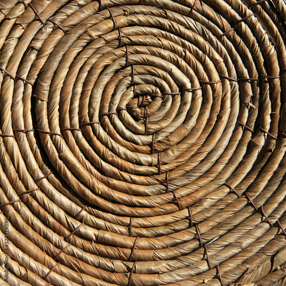 Wicker basket bottom. Circle spiral pattern. Wicker basket bottom. Circle spiral pattern.