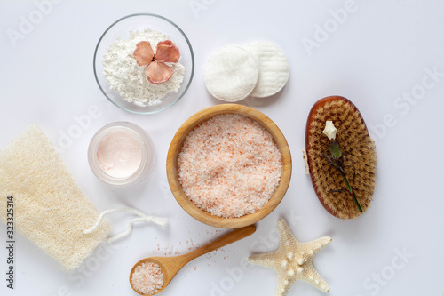 Natural cosmetics for skin care treatment: sea salt, cream and face mask.