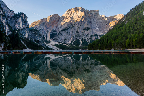 Beautiful reflection of Seekofel mountain in Lake Braies at sunrise, Italy