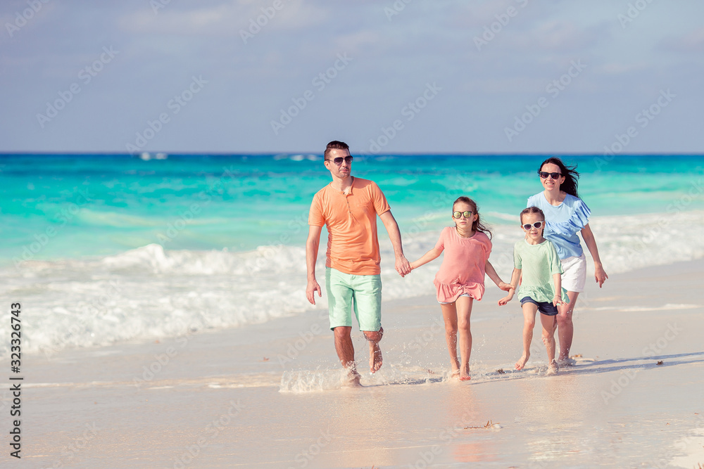 Young family on vacation on the beach Young family on vacation on the beach
