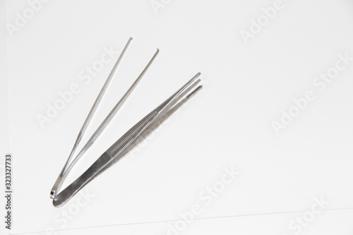 medical tweezers for surgery on a white background