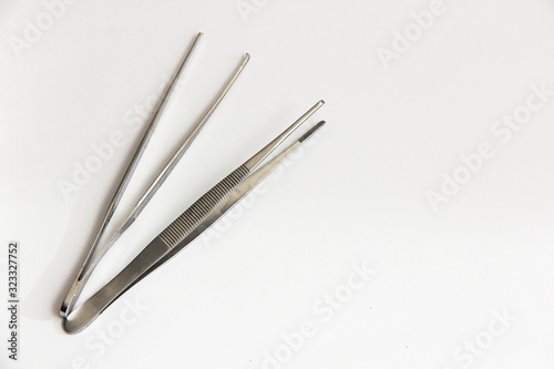 medical tweezers for surgery on a white background