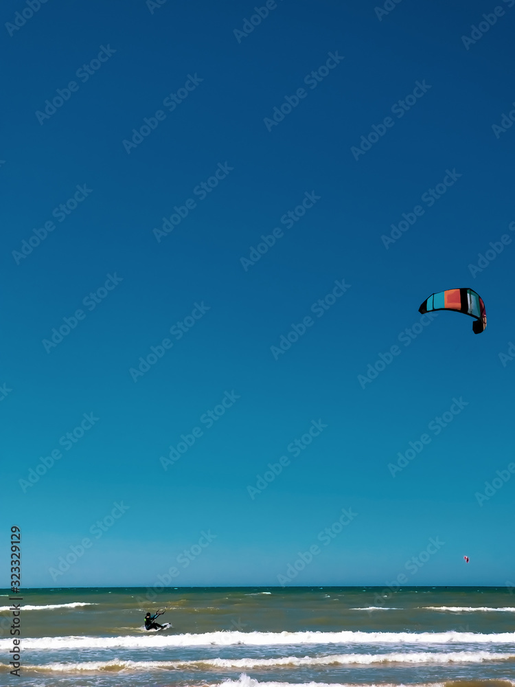 kitesurf athlete rides the waves of the Baltic Sea kitesurf athlete rides the waves of the Baltic Sea