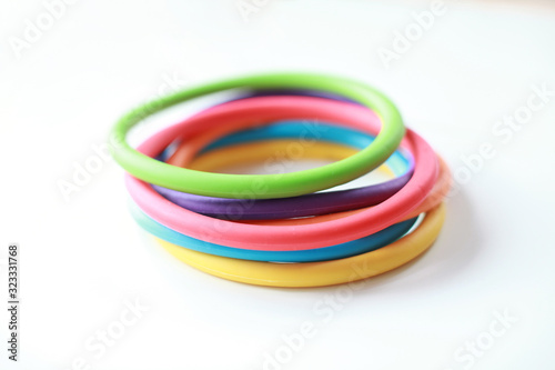 Colourful silicone rings open ended toy on a white background