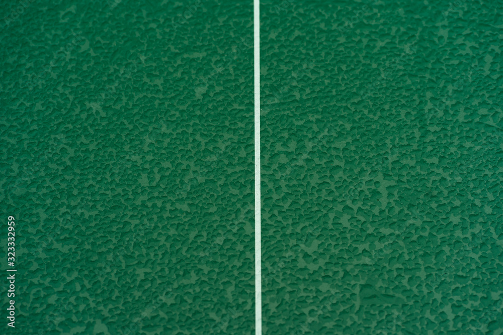 Table Tennis or ping pong rackets and balls on table. Sport concept.Texture of green wooden table,equipment for table tennis sport