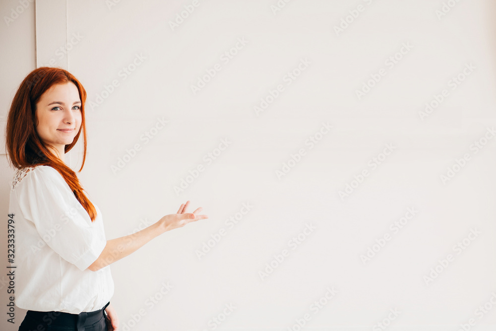 Successful business woman in modern office, pointing on copy space. Business, professional occupation and career Successful business woman in modern office, pointing on copy space. Business, professional occupation and career