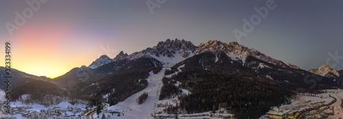 Dolomites Mountain in winter, by San Candido, Alto Adige Italy. Sunrise in Monte Baranci Haunold. Aerial drone shot in january 2020