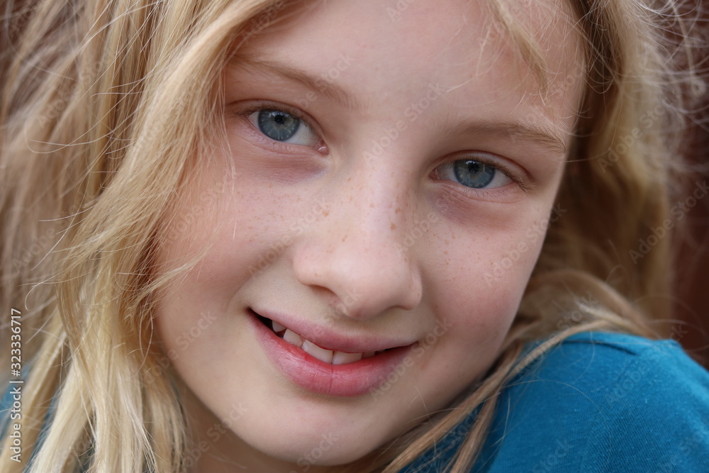 Closeup of a smiling beautiful innocent blonde teenage girl Closeup of a smiling beautiful innocent blonde teenage girl