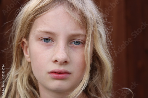 Konstfotografi Portrait of a young teenage girl with a serious stare