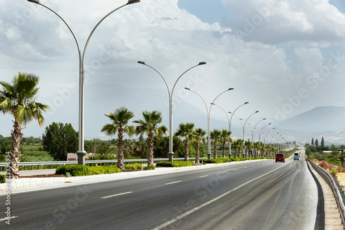 Photography Straight road background with cloudy sky.