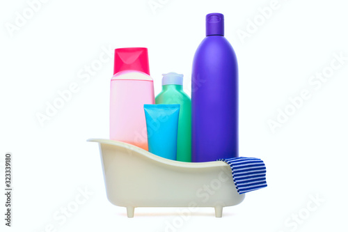 Cosmetic bottles in bathroom isolated on white