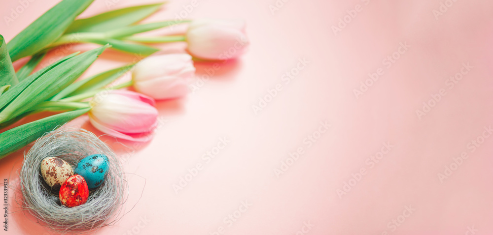 Pink tulips and easter eggs on pink background Pink tulips and easter eggs on pink background