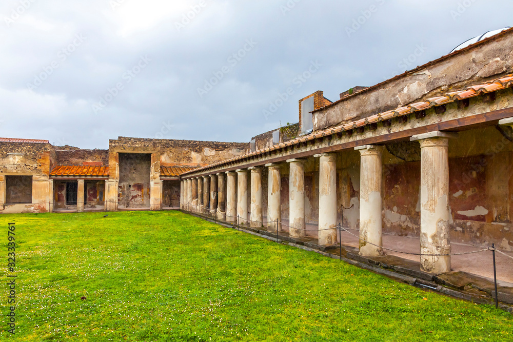 Fototapeta premium Ruins of Ancient Roman city of Pompei, Italy. Pompei was destroyed and buried with ash after Vesuvius eruption in 79 AD